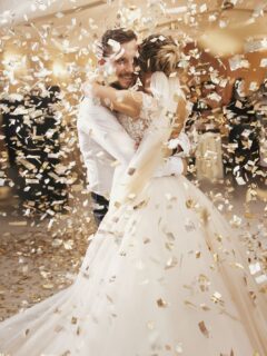 Bride and groom dancing with confetti in the air
