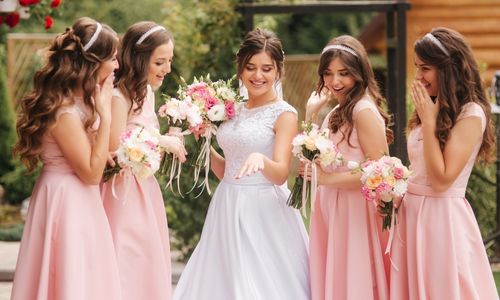 Bride with her bridesmaids on the wedding day 