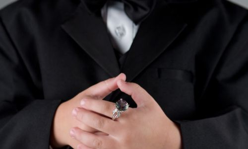 Ring bearer holding the ring on his finger