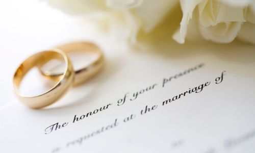 Rings and wedding invitation