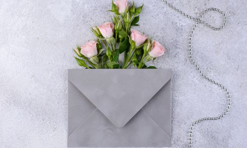 Roses and envelope wedding invitation