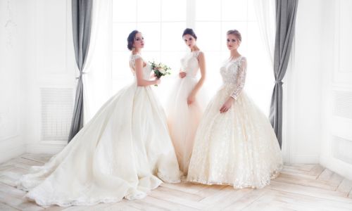 Three models modeling wedding dresses