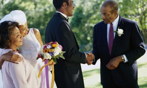Father of the bride shaking hands with the groom
