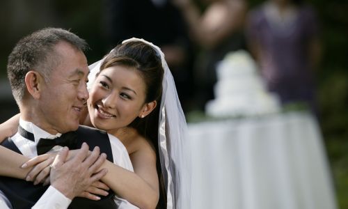 The bride hugging her father