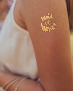 Golden temporary arm tattoo for the maid of honor